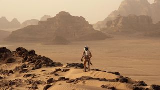 Mark Watney (Matt Damon) walking on the surface of Mars in "The Martian" 