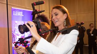 Catherine, Duchess of Cambridge holds a video camera while speaking to people from the ELEVATE initiative
