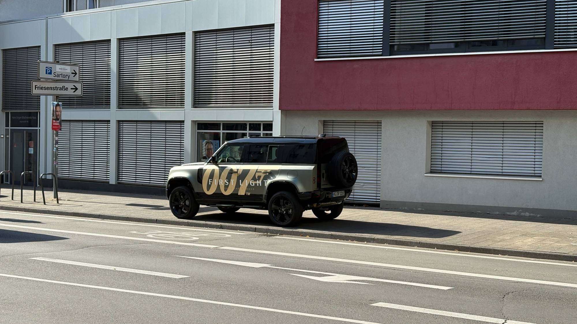 A parked car with 007: First Light decal