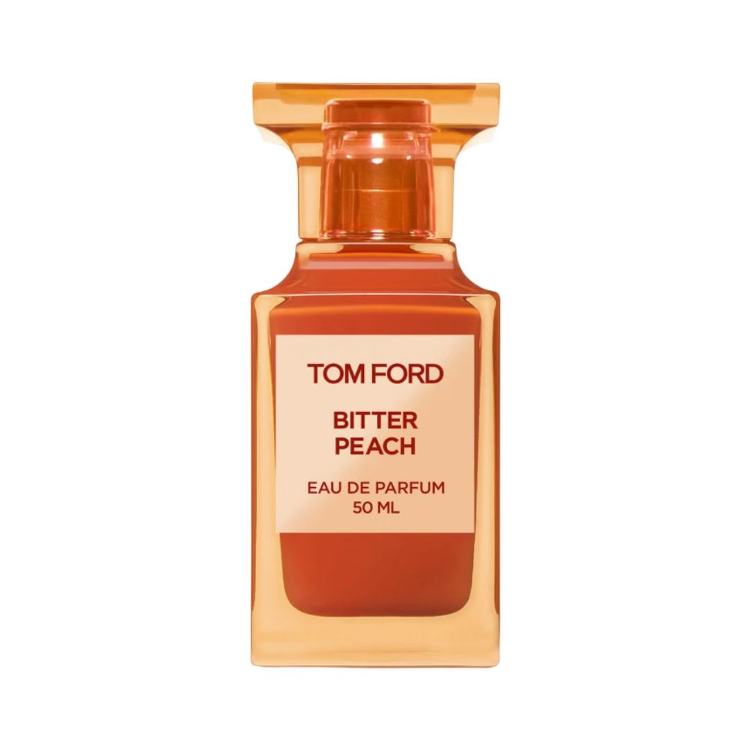 A product shot of the orange bottle of Tom Ford Bitter Peach eau de parfum, pictured on a white background
