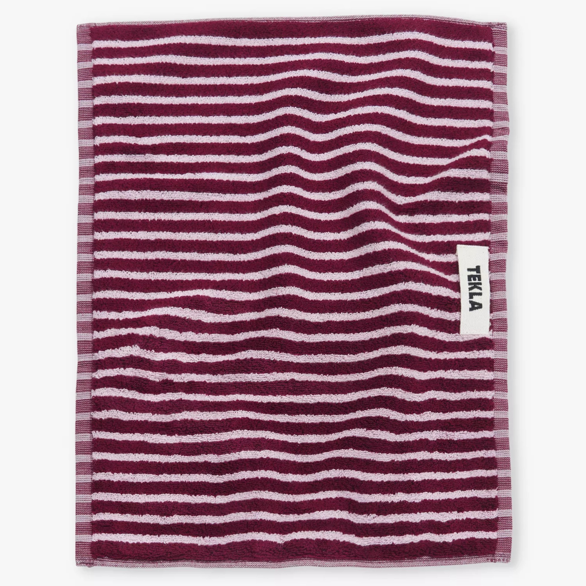 Tekla Bordered organic-cotton hand towel