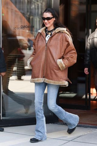 Bella Hadid wearing tan leather aviator jacket