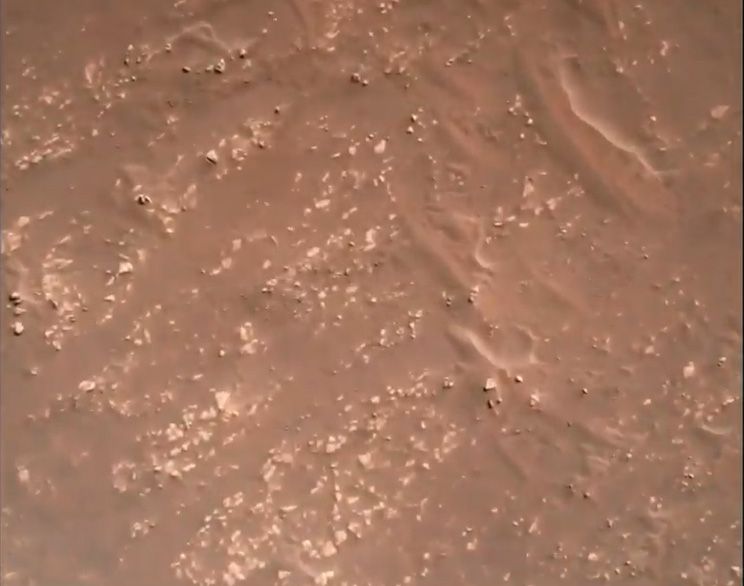 NASA's Perseverance rover captured this view from its entry, descent and landing camera system as it descended to the surface of Mars on Feb. 18, 2021.