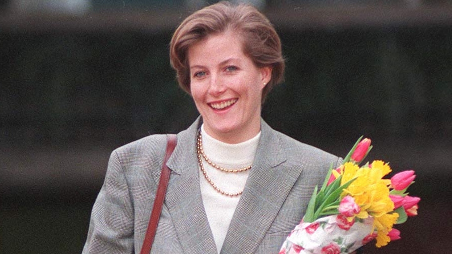 Duchess Sophie wearing a blazer and holding flowers on her 30th birthday in 1995