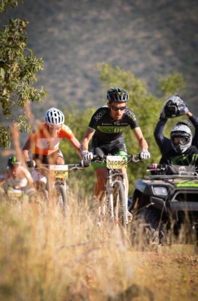 David George sets the tempo up the climb, followed by Max Knox