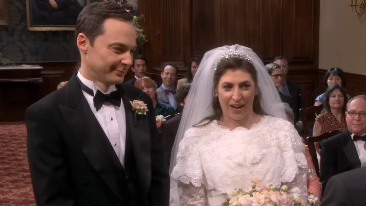 Sheldon and Amy standing side by side during their wedding.
