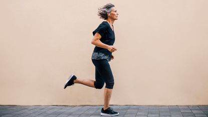 Woman in her 50s running to lose weight