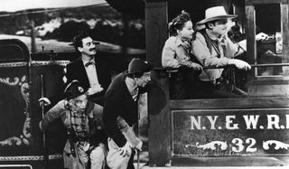 The Marx Brothers on board a train in Go West