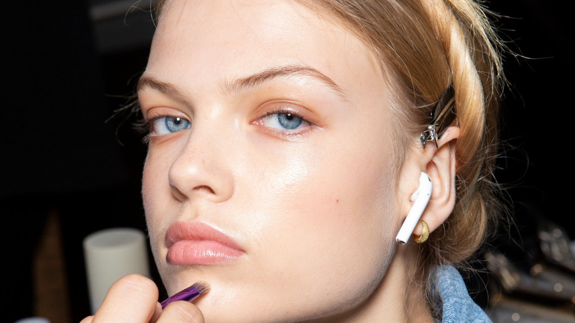 model backstage with glowing skin