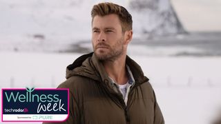 Chris Hemsworth looks over his shoulder in a snowy mountain range
