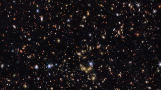 Thousands of galaxies in various shapes and sizes are captured in this new image from the James Webb Space Telescope. More distant galaxies appear redder and smaller, compared to galaxies that are closer and appear larger and white or blueish. 