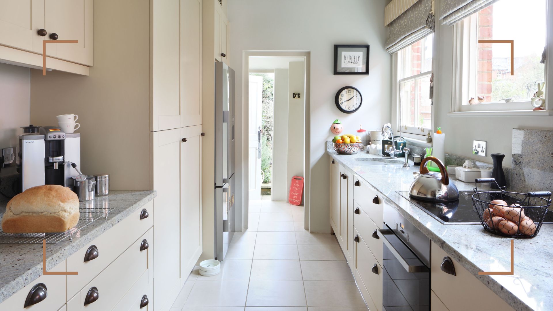 Cream galley kitchen with a door out to garden access to support expert advice on how to make a galley kitchen look bigger with design tips