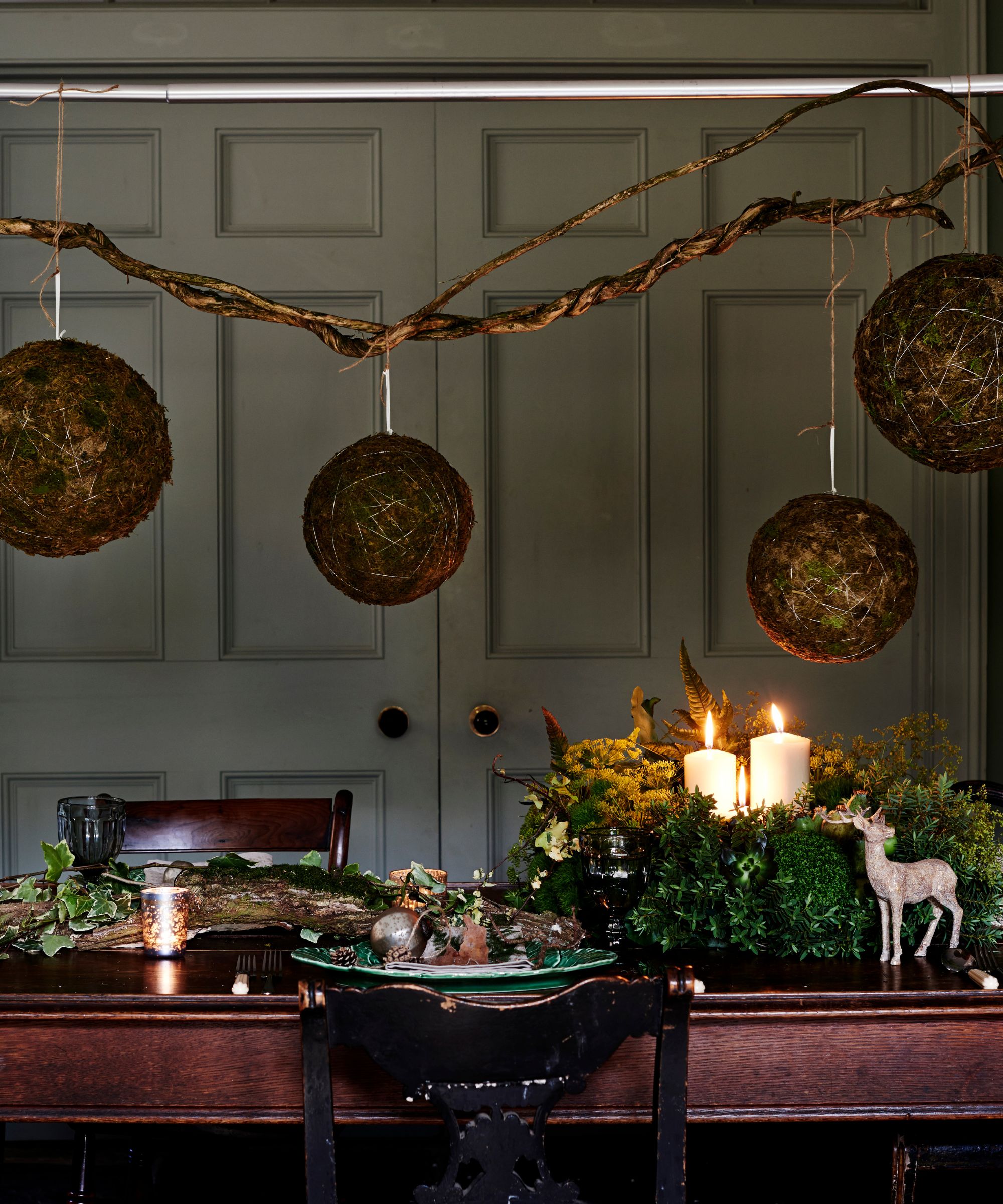 Natural Christmas table setting with greenery and branches