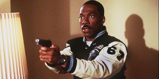 Axel Foley (Eddie Murphy) holds up a gun in Beverly Hills Cop IV (1994)