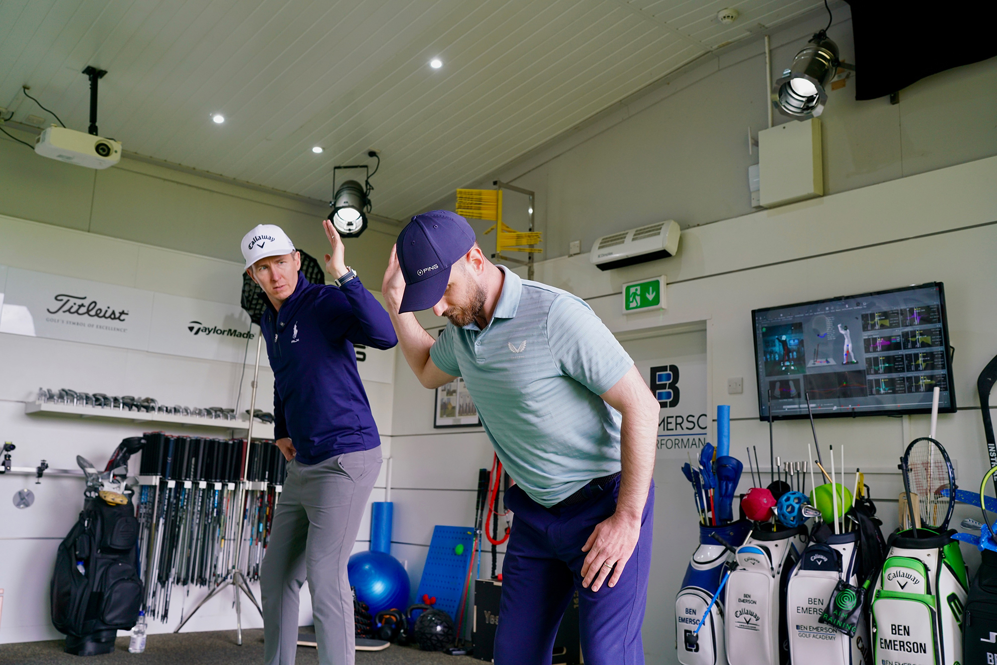 Baz Plummer carrying out an aspect of the TPI screening, watched by coach Ben Emerson, where he is measuring the range of motion in his trail shoulder