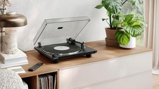 Sharp RP-TT100 turntable on a wooden counter