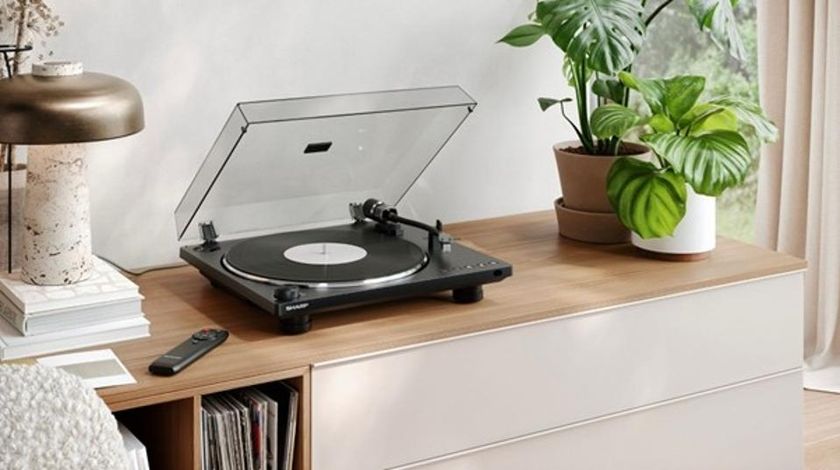 Sharp RP-TT100 turntable on a wooden counter