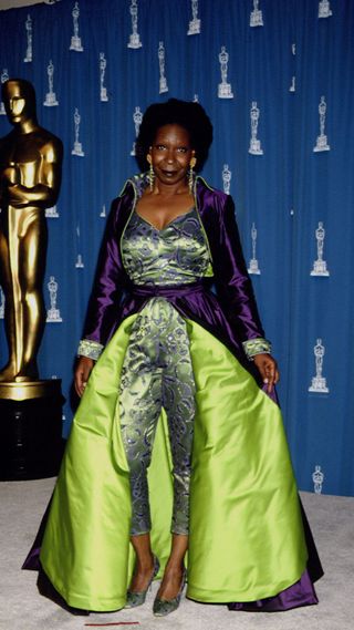 Whoopi Goldberg in a green and purple look