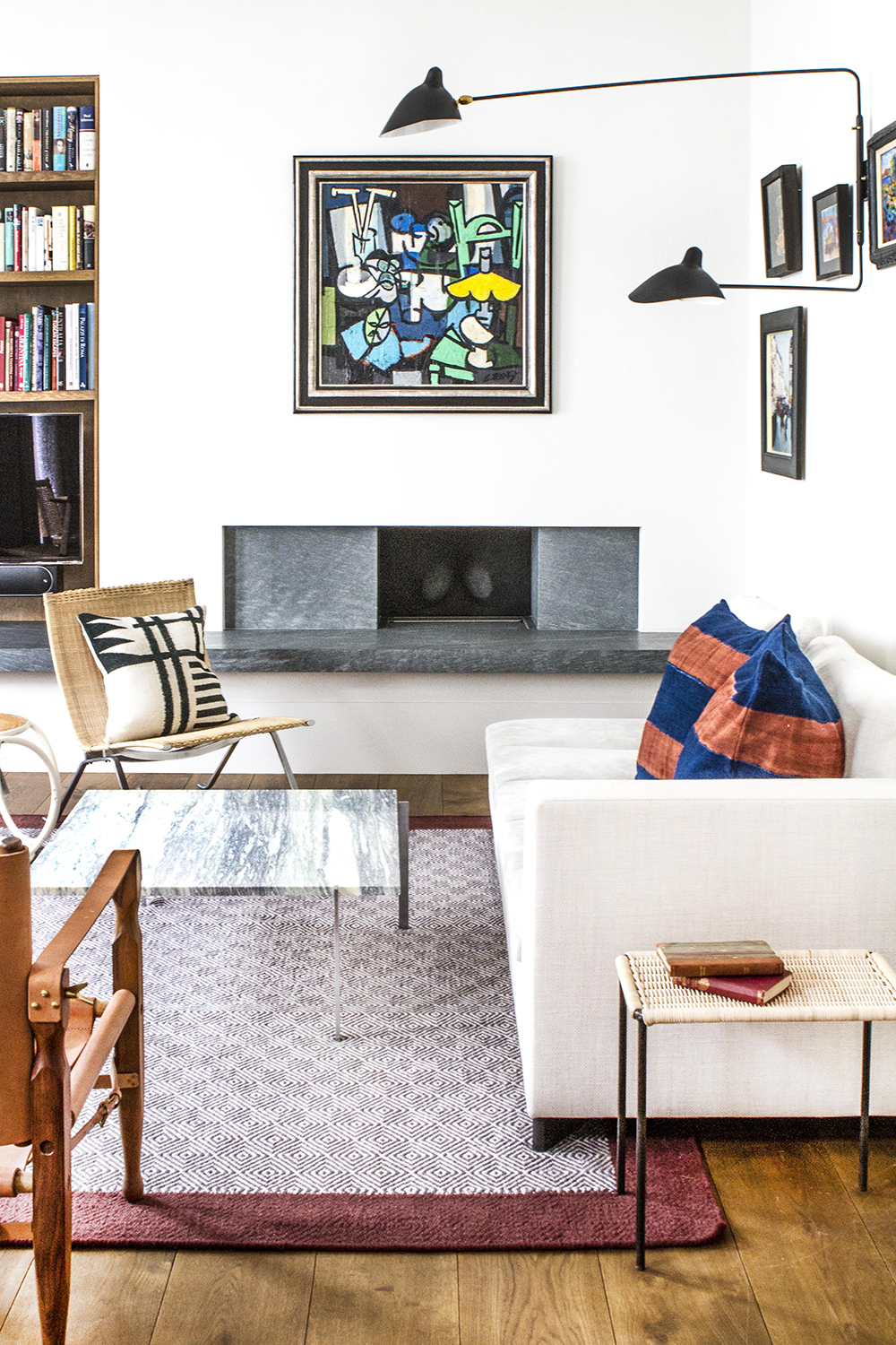 white living room with modern furniture and glass coffee table