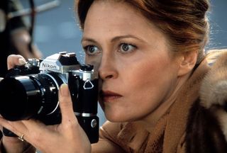 Faye Dunaway holding Nikon FM camera