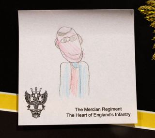 A crayon drawing of Prince William on a white piece of paper done by a child