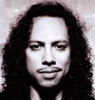 Metallica’s Kirk Hammett posing for a photograph in 2003