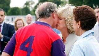 King Charles kissing Queen Camilla during a Polo game in 2005