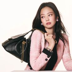 Jennie wears the Chanel 25 Handbag