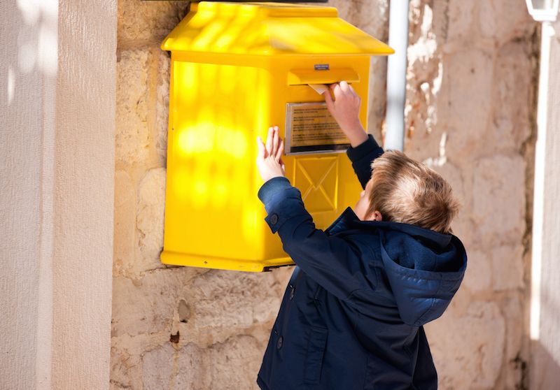 Boy mailing letter