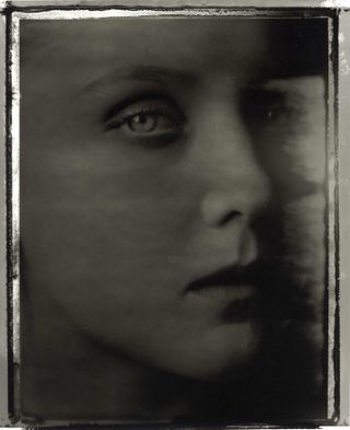 Black and white photographic artwork of woman's face: Julie Stouvenel, 1989. The Red Thread