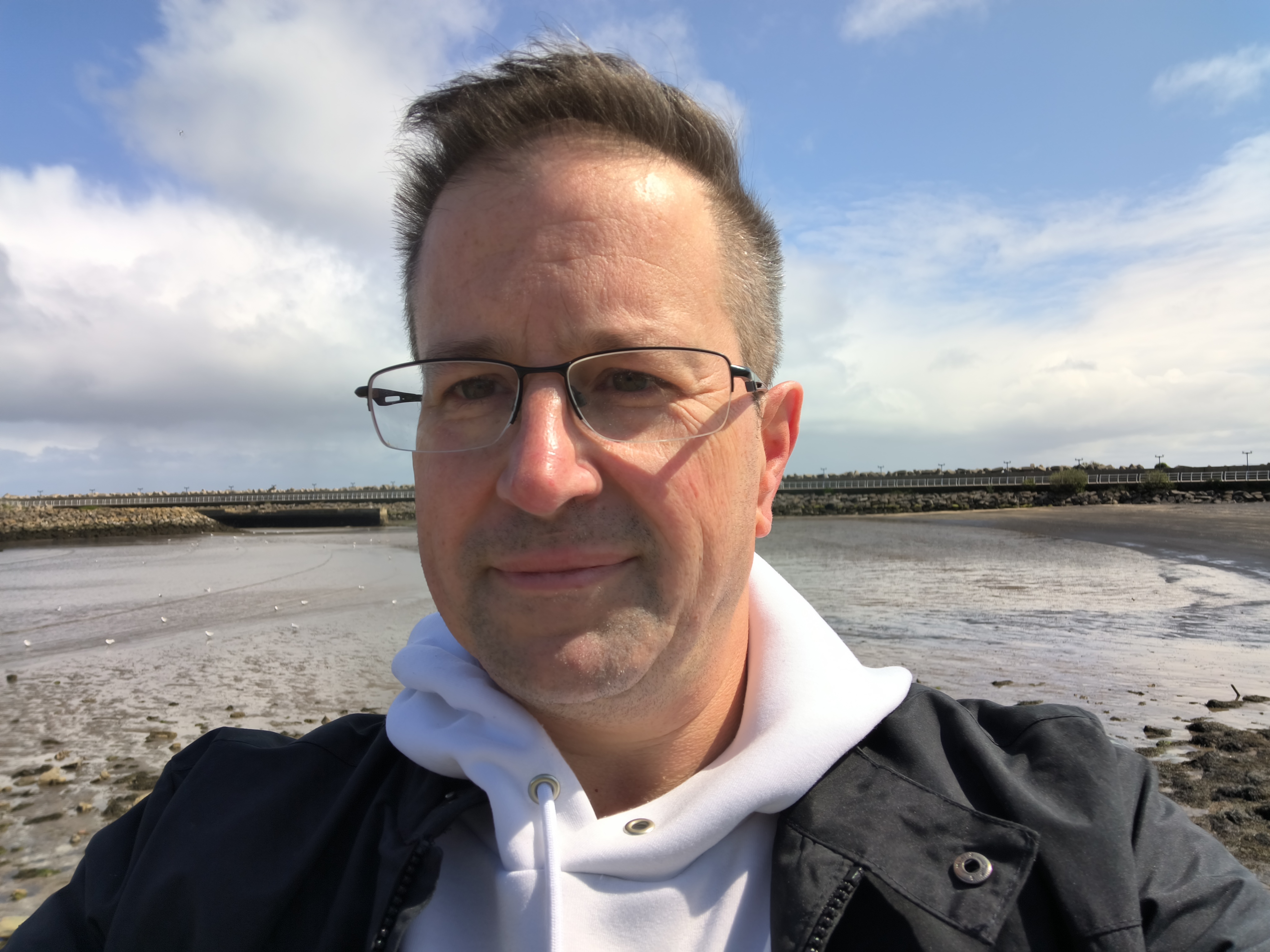A selfie taken on a sunny day by the beach