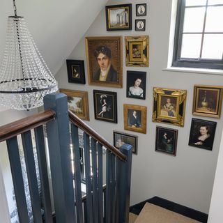 staircase with picture gallery