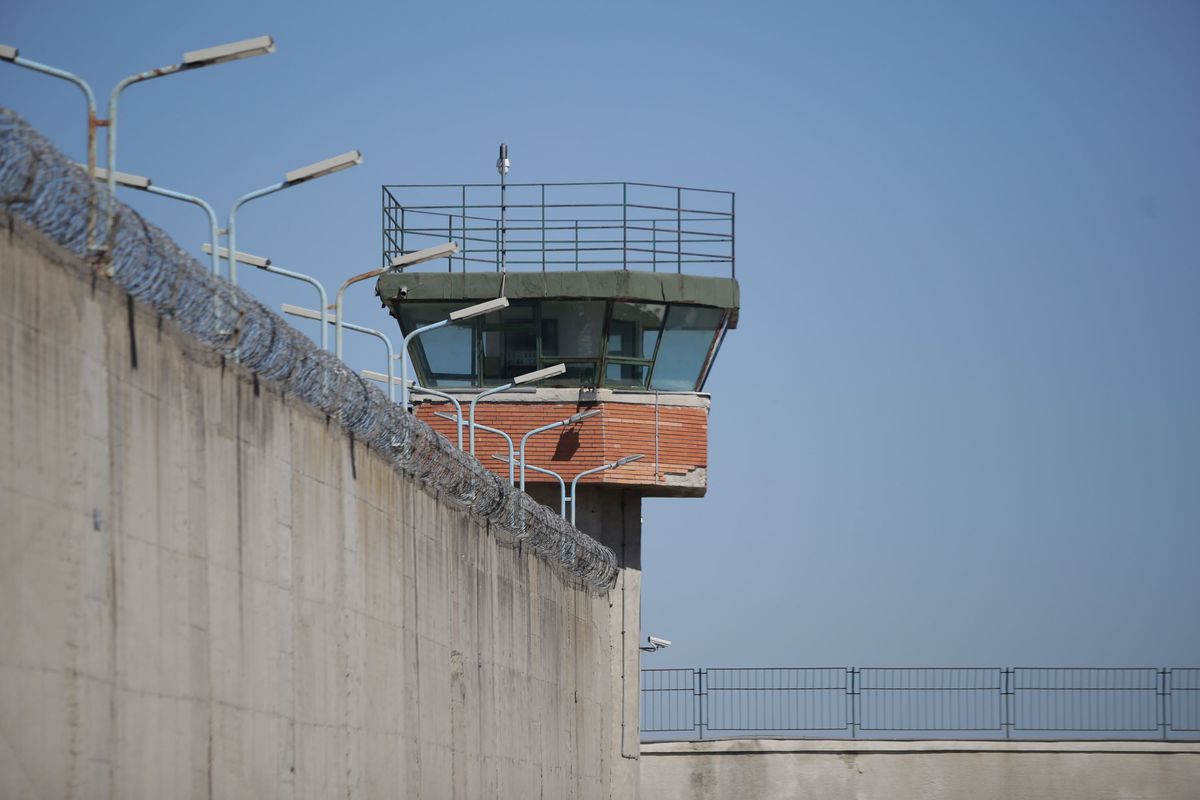 A prison wall and tower.