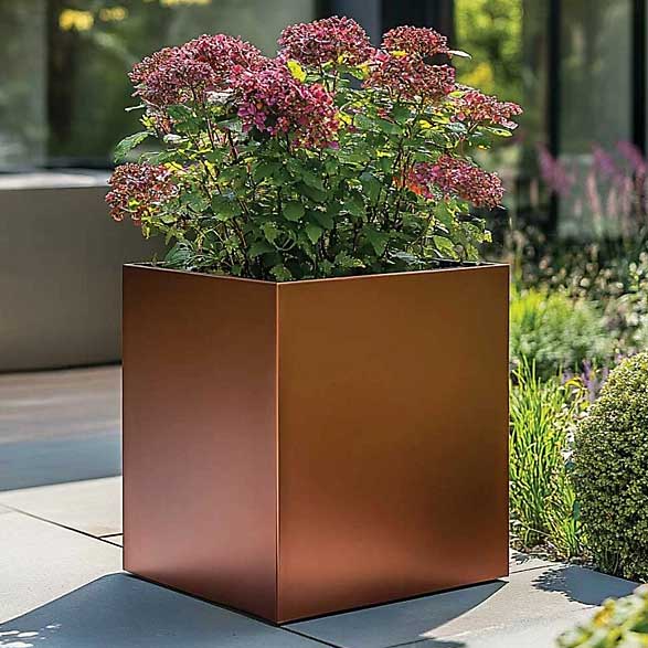 copper-effect planter on a patio