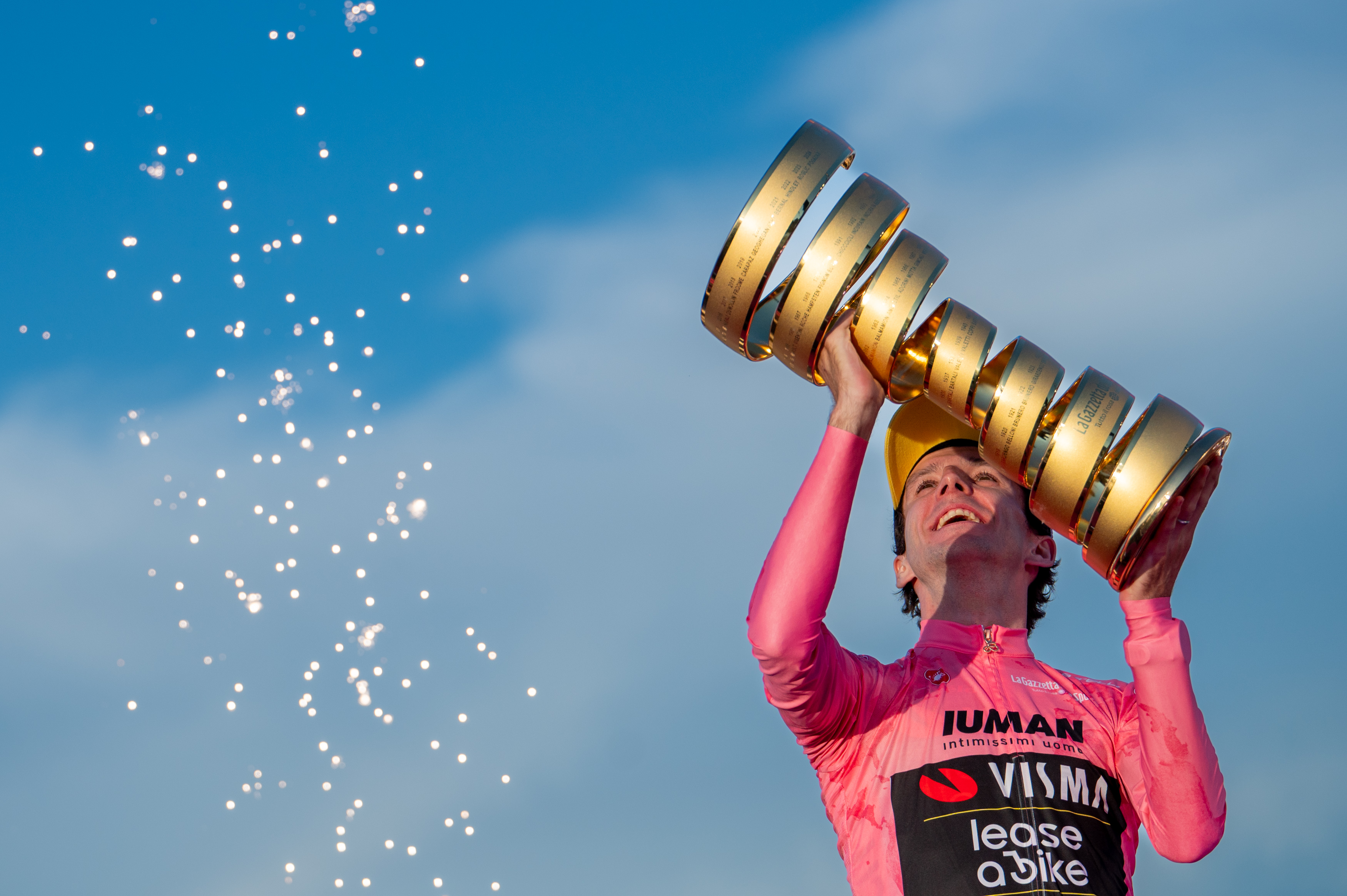 Simon Yates lifts the Giro d'Italia trophy