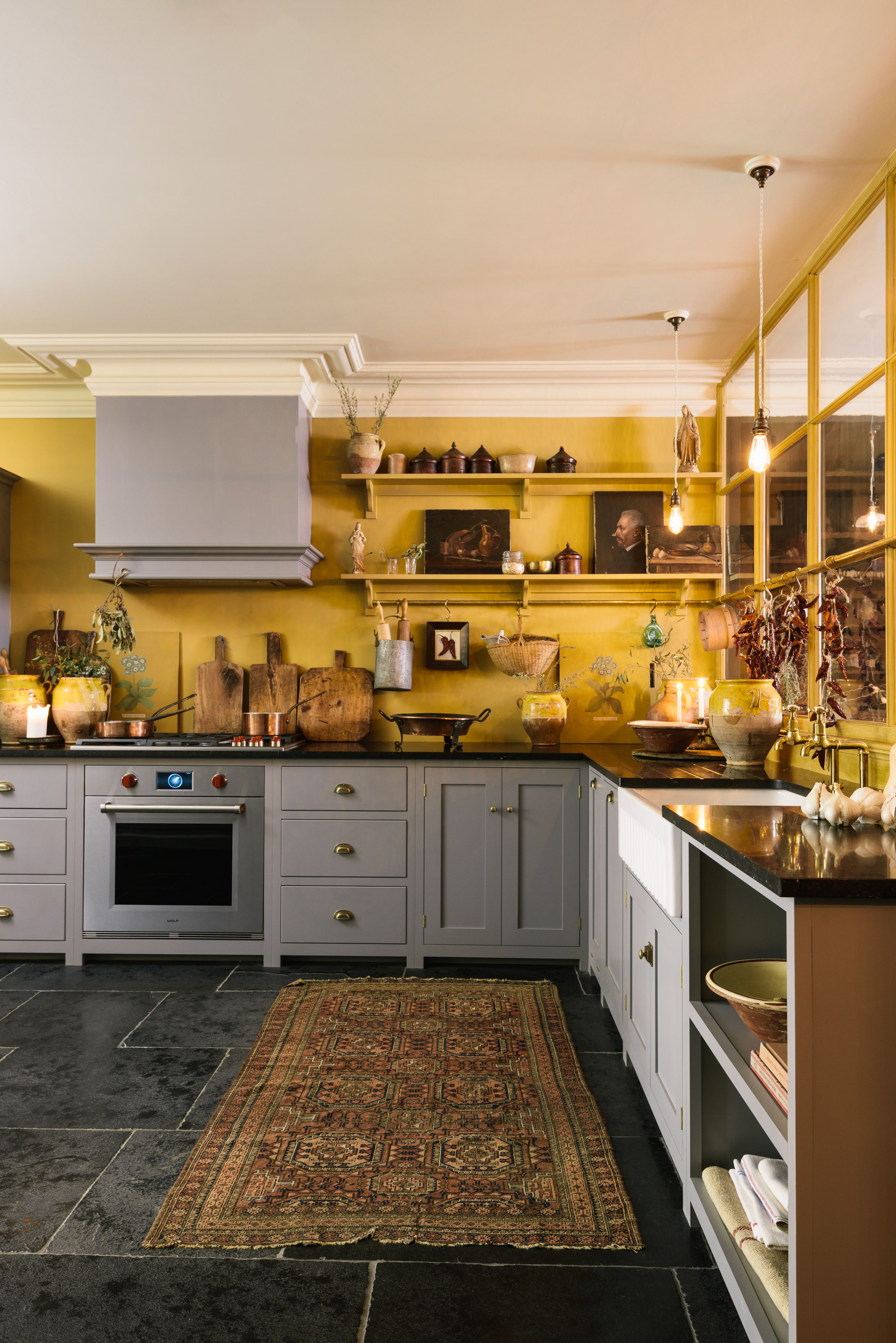 Grey kitchen with yellow walls