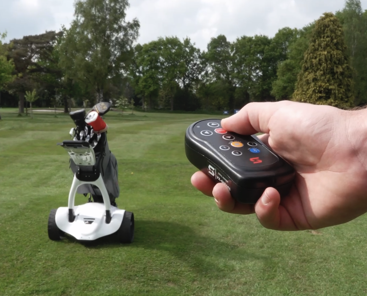 The remote being used on the Stewart Golf V10 Remote electric trolley