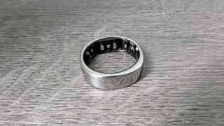 The RingConn Gen 2 Smart Ring on a gray surface