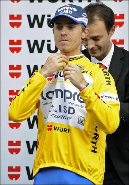 Damiano Cunego (Lampre-ISD) dons the leader's yellow jersey.