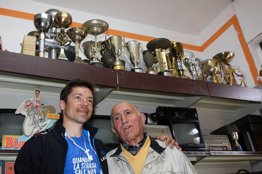 Former Bartali mechanic Ivo Faltoni shows off some of the trophy's he collected during a lifetime in cycling