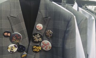 Pressed flower badges and Prince of Wales checks at Dior Homme