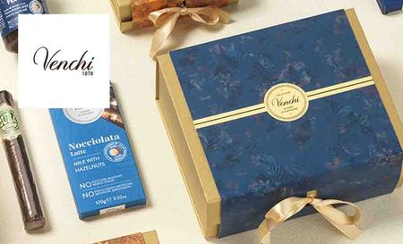 Venchi logo placed over an image of venchi chocolate boxes and sweets
