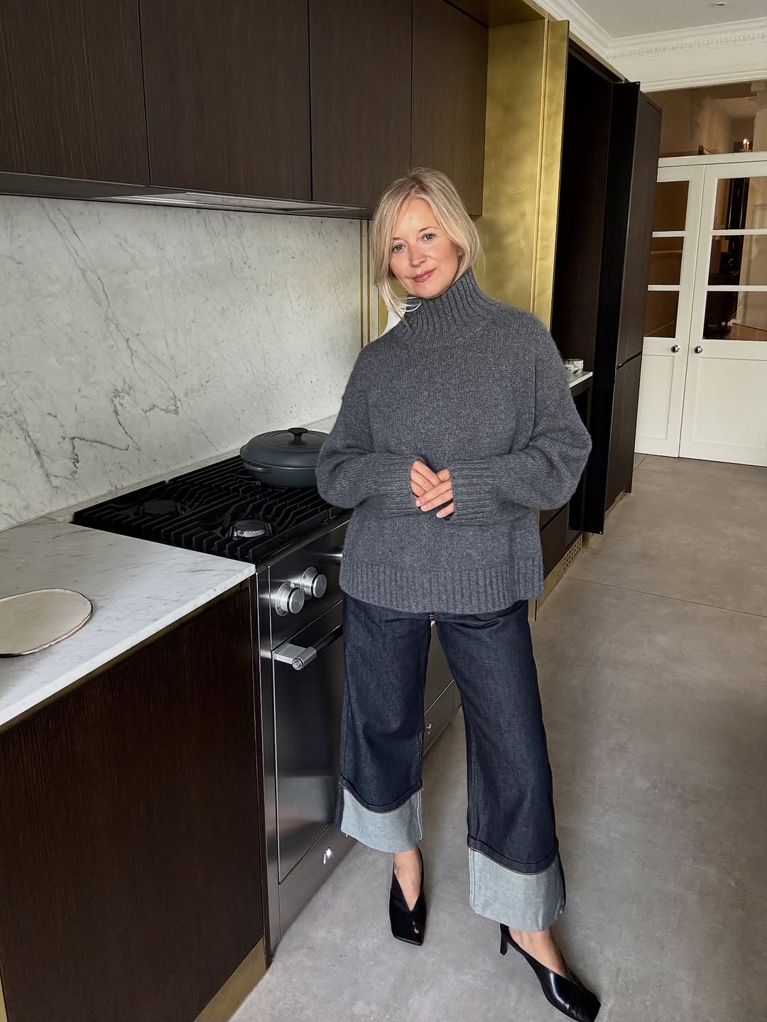 woman wearing gray sweater spring outfit 2026