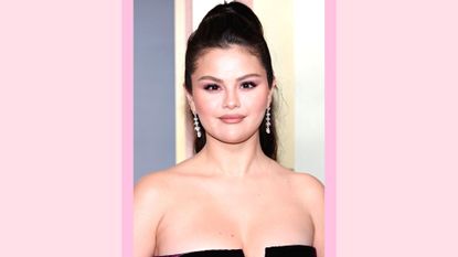 Selena Gomez wears her hair in a ponytail and wears a black dress as she attends the 80th Annual Golden Globe Awards at The Beverly Hilton on January 10, 2023 in Beverly Hills, California/ in a pink template