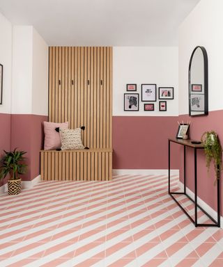 pink and white diagonally striped hallway floor