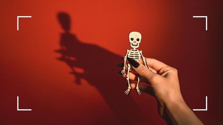 woman holding a skeleton to represent 'Zombieing dating trend'
