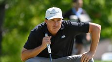 Kevin Roy crouches down behind a putt at the 2024 Albertsons Boise Open