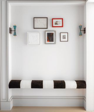 Small entryway ideas with bench and wall lighting