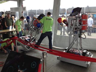 Two "boxing bots" are set up inside the Microsoft tent at World Maker Faire in New York on Sept. 21, 2013.