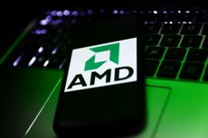 Advanced Micro Devices, or AMD, logo on smartphone screen with laptop in background